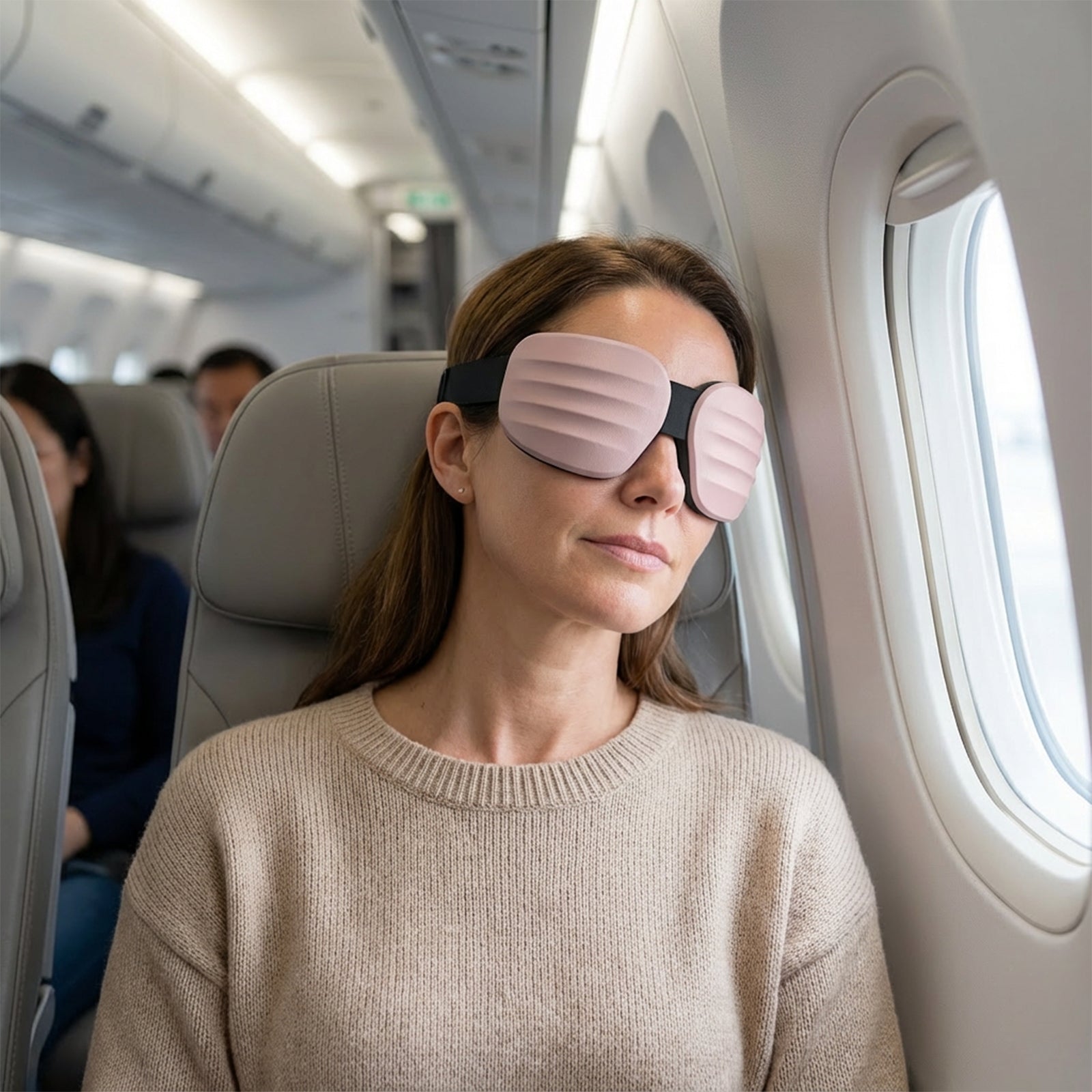 Fismool Pocket Mask worn during flight, providing light blocking and comfortable rest for travel and in-flight sleep.