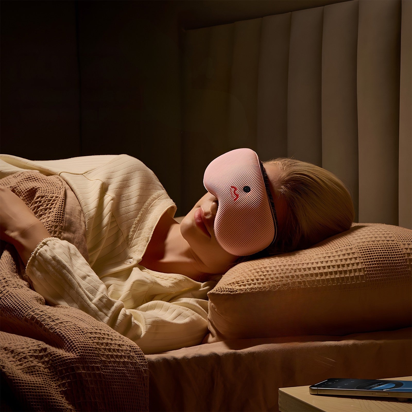 Fismool sleep mask with headphones used at night, featuring Bluetooth audio and an auto-off sleep timer for uninterrupted sleep